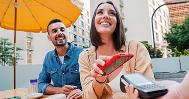 digital wallet couple ready for the bill at restaurant