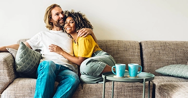 couple cuddling on new couch